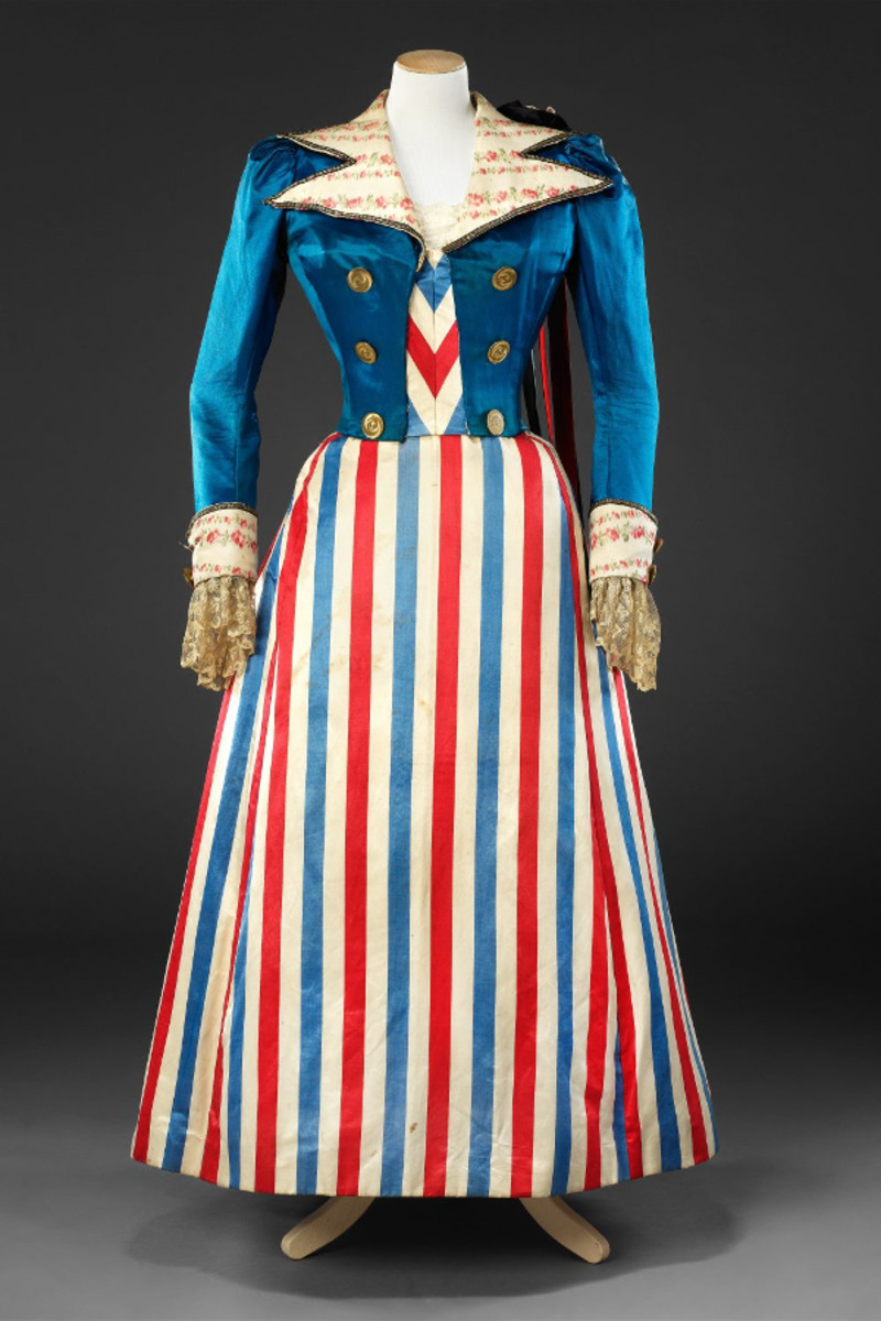 Holt's Incroyable costume was likely the source for the design and construction of this fancy dress outfit from the 1890s, made of satin, trimmed with warp-printed grosgrain, lace, braid and metal buttons.