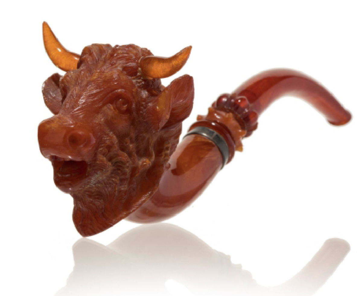 Rarity of rarities, a high-relief-carved figural in solid amber of a bull, late 19th century.