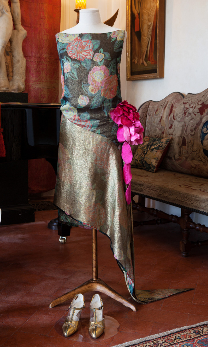Dated 1929, this floral print silk (lamé) Callot Soeurs' cocktail sheath dress, with an extravagant pink rose on the hip, is an indication of the glamorous lifestyle Hortense Mitchell Acton enjoyed at Villa La Pietra.