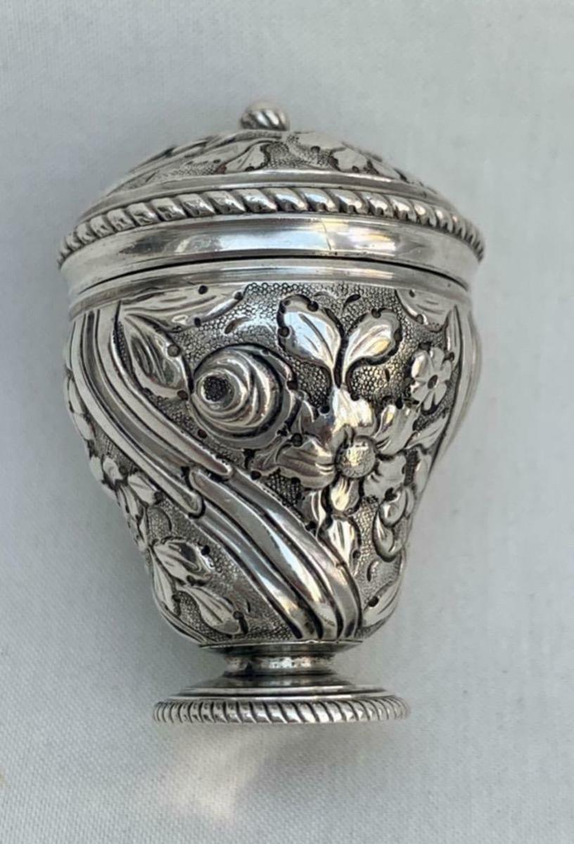 An urn form Georgian English silver nutmeg grater with all over repousse decoration and rope twist edges, circa 1770, 1-1/2” x 1”; $416.