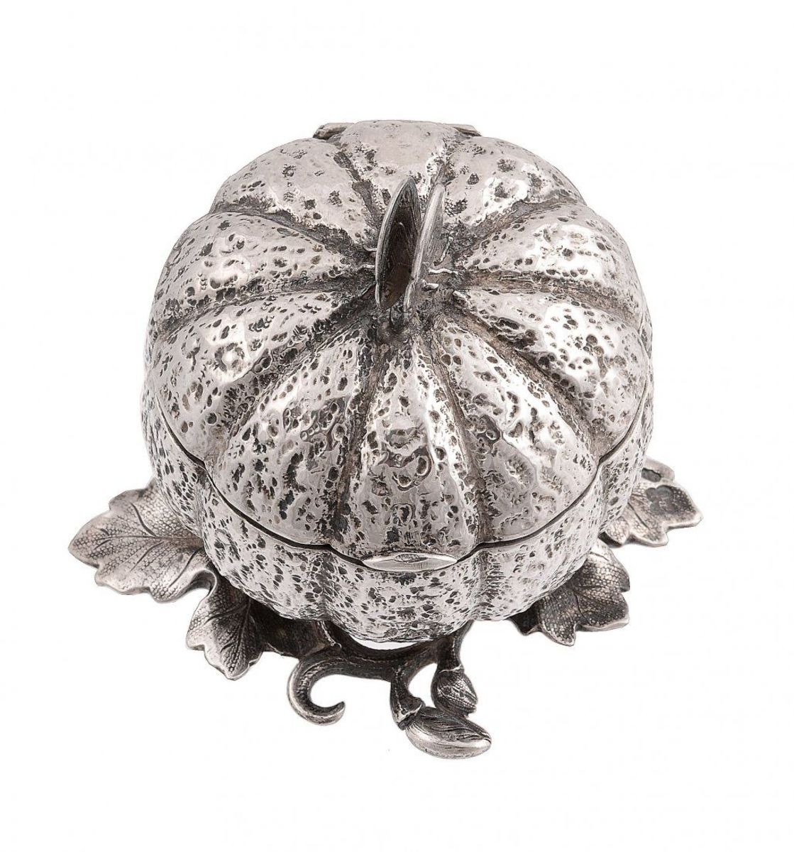 An unusual early Victorian silver table-top nutmeg grater by Edward, Edward Jr., John & William Barnard, London, 1846, with a butterfly finial to the hinged cover, a hinged steel grater inside and a cast leafy base, 2-1/2” h; $10,000.