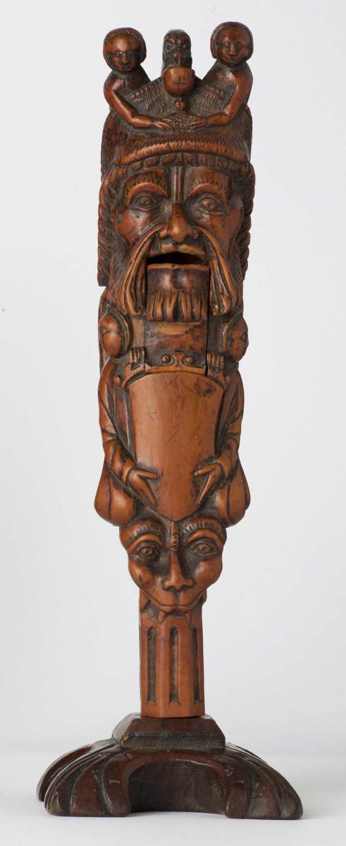 This decorative figural nutcracker with original base, circa 1500 from France, is Arlene Wagner's favorite lever nutcracker. The boxwood carved nutcracker is 10" tall.