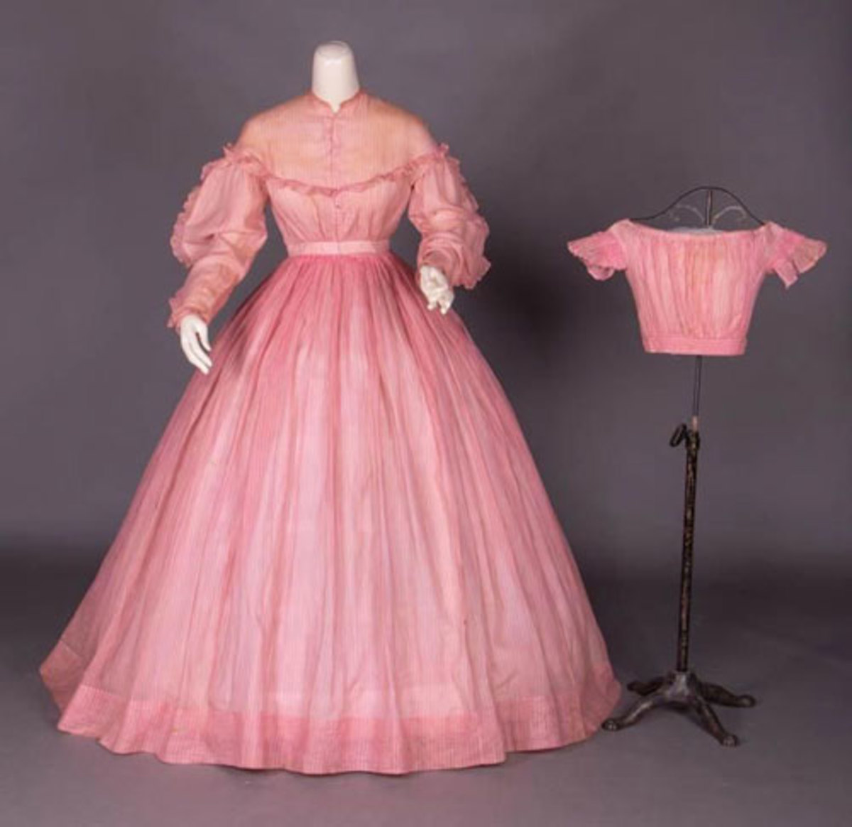 How adorable is this? A day dress for mother and a matching bodice for daughter, circa 1860, in leno weave pink and white cotton, with fine woven vertical stripes. Estimate: $500-$800.