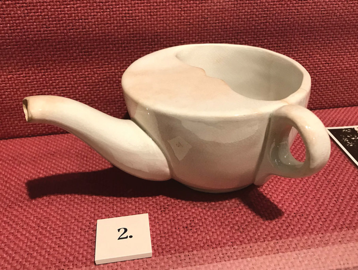 This ceramic invalid feeder pap boat from the turn of the 20th century was used to feed gruel or other soft foods to recovering patients, and are collectible.