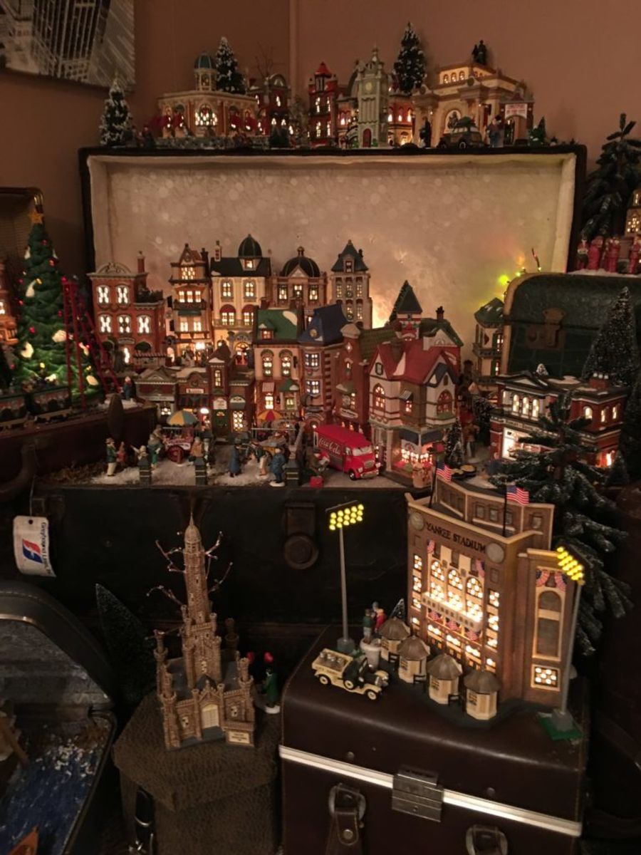 One of longtime Department 56 collector Brandon Taylor’s favorite home displays is the popular “Christmas in the City” display, which he showcases in old steamer trunks.