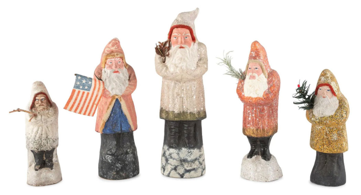 Five papier-mâché Belsnickle figures, likely German, circa 1900 and later, one holding an American flag and the tallest is 11-1/2" h. The set sold in December for $4,750, thousands higher than the estimate of $400-$600.