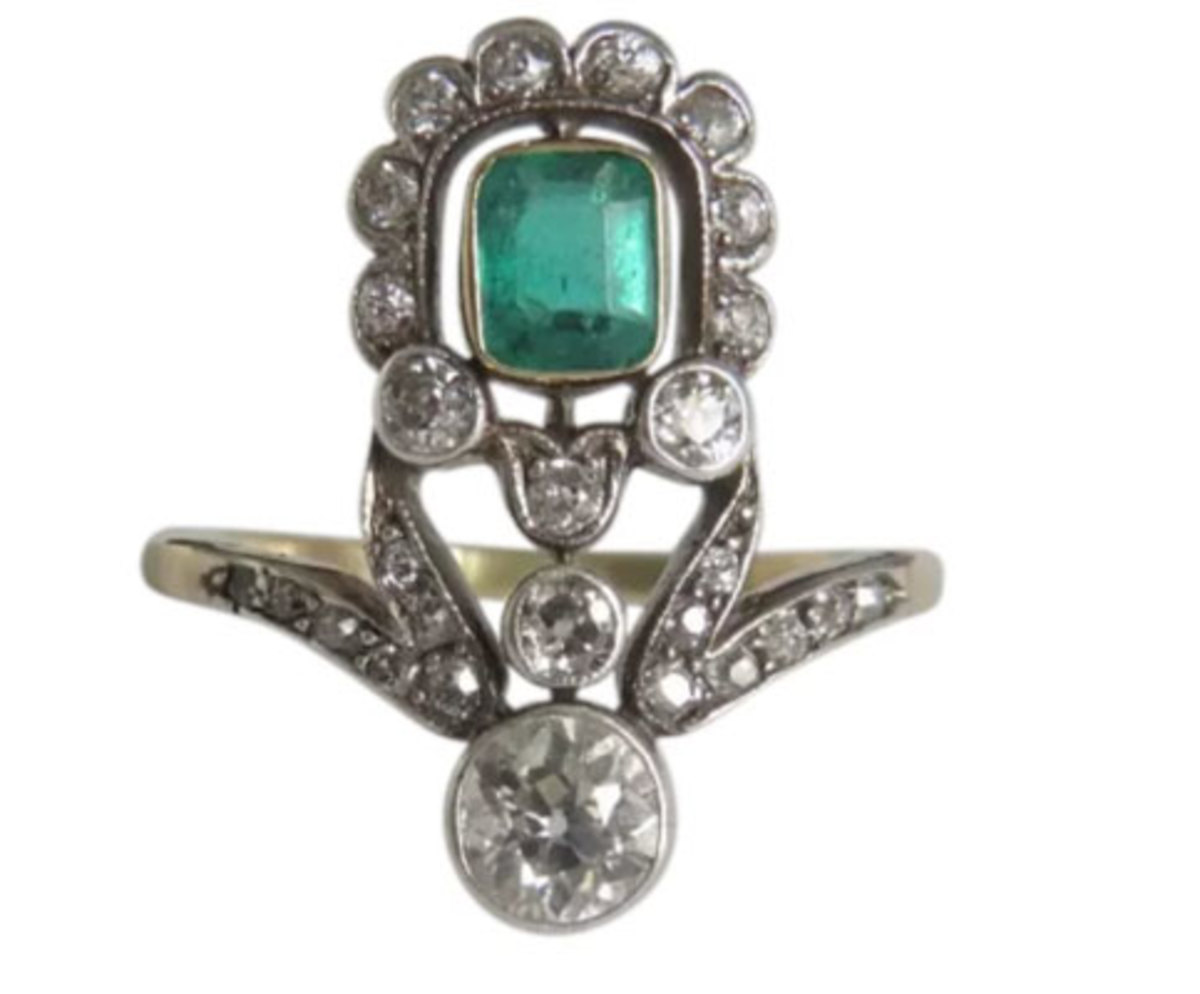 Engagement rings don’t have to include  only diamonds. The center of this Art Nouveau piece, circa 1900, is a natural emerald, the green color of which represents luck, love and new beginnings; $3,600.