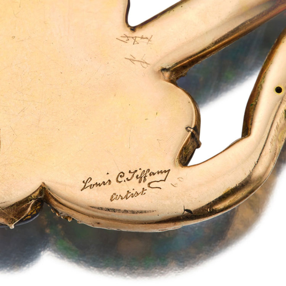 Louis Comfort Tiffany's signature on the back of the pendant.