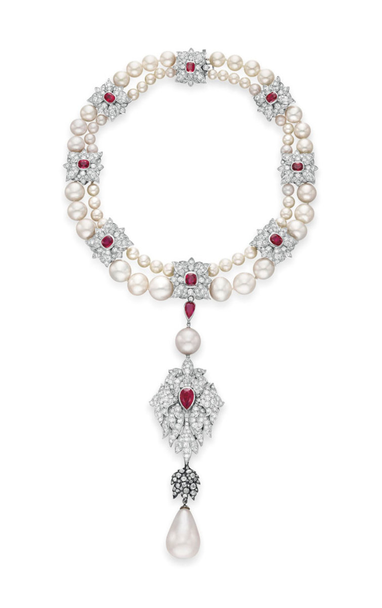 The grand and world-famous La Peregrina pearl, suspended from a natural pearl, diamond, ruby and cultured pearl necklace by Cartier that Taylor helped design. This sold for $11.8 million.