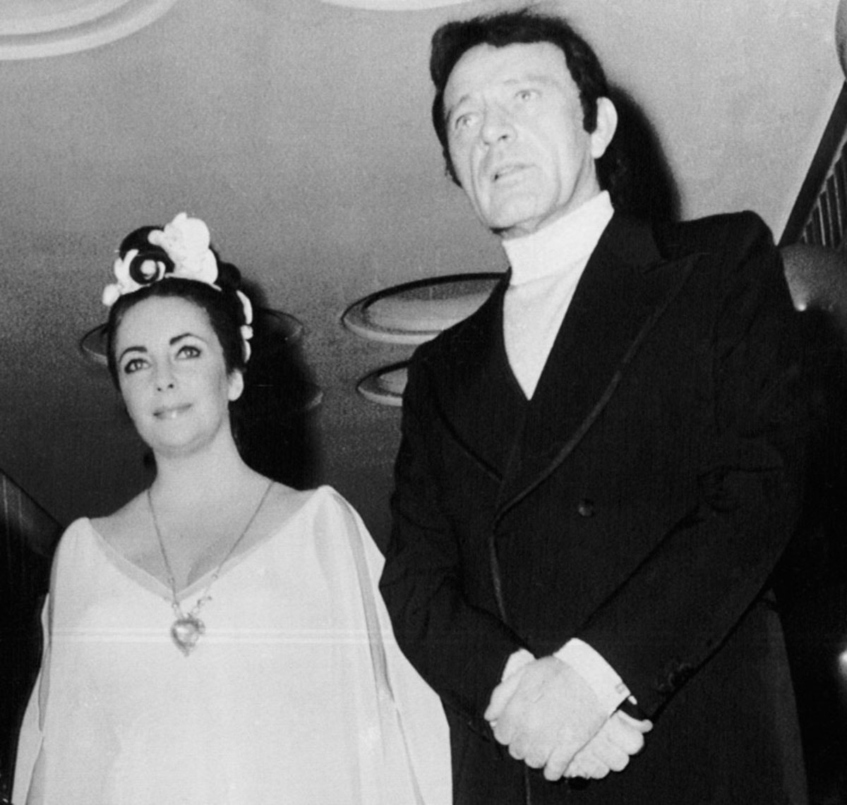 Elizabeth Taylor, wearing the Taj Mahal pendant, and Richard Burton arrive at her $72,000 star-studded 40th birthday party.