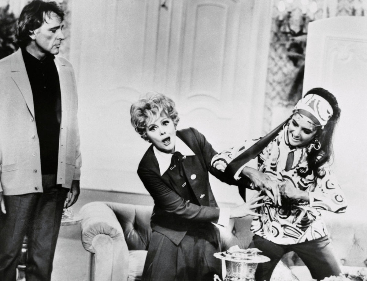 Lucille Ball and her special guests, Elizabeth Taylor and Richard Burton, become involved in a "rocky" situation centering on Taylor's $1.5 million diamond ring, which seems firmly lodged on Lucy's finger, on the third season premiere of the "Here's Lucy" TV show.