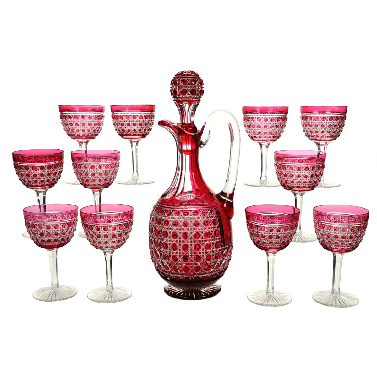 American Brilliant Period Cut Glass decanter set, with red cut to clear in the Cane pattern and with a pattern cut stopper. Estimate: $1,500 to $3,500.