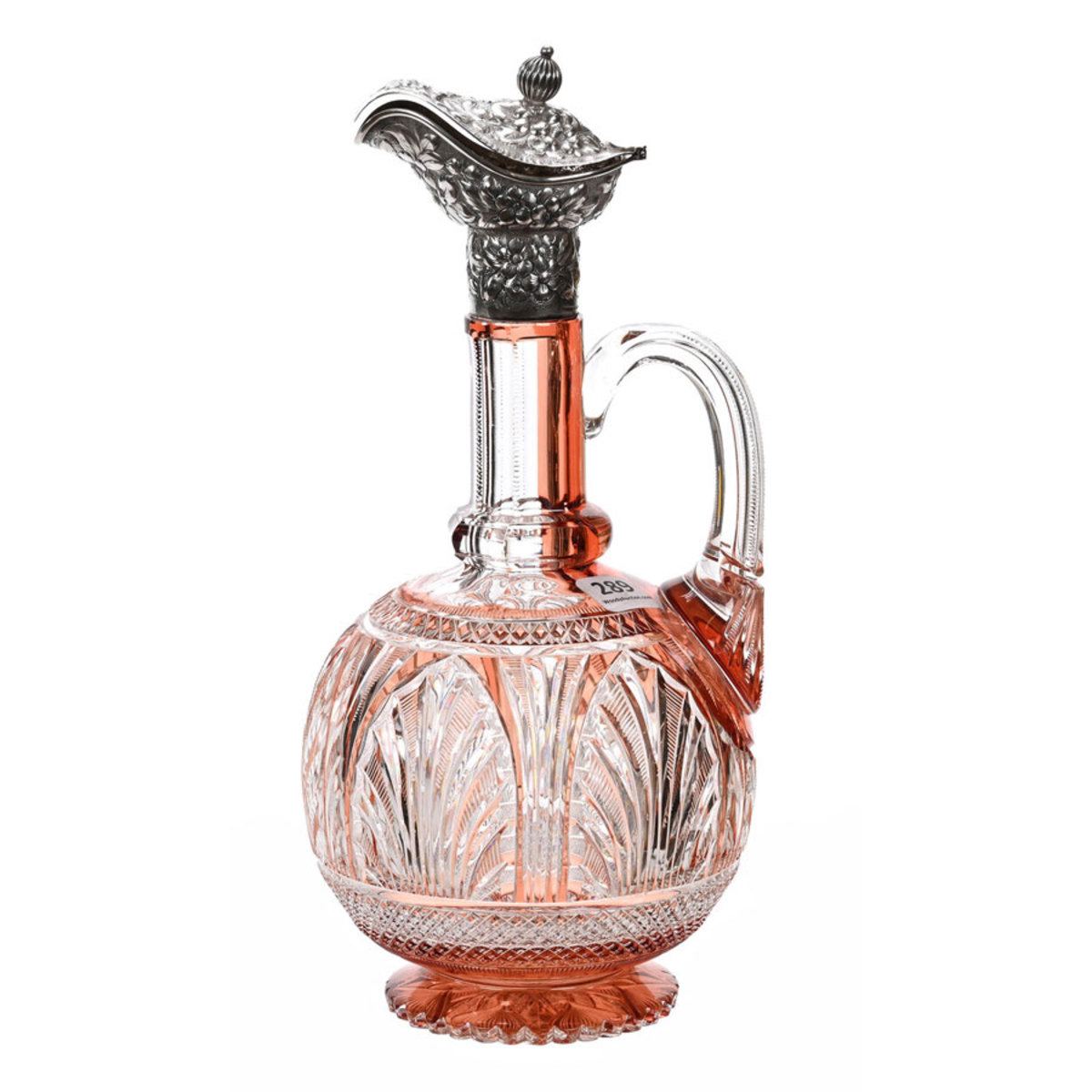 Brilliant Period Cut Glass handled decanter, apricot cut to clear, 11" h, with a beautiful embossed floral sterling silver lidded spout marked Theodore B. Starr and a scalloped pattern cut foot. Estimate: $2,000-$4,000.