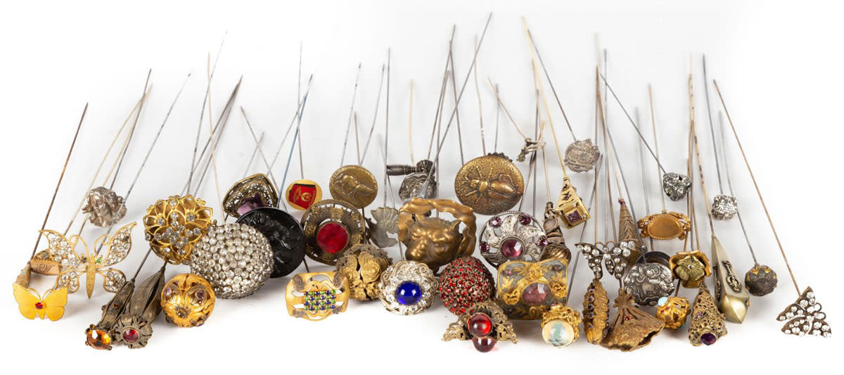 A group of hatpins from the 19th and 20th centuries in a variety of styles; the maximum diameter is 2". This lot sold in January for $4,750 against an estimate of $400-$600.