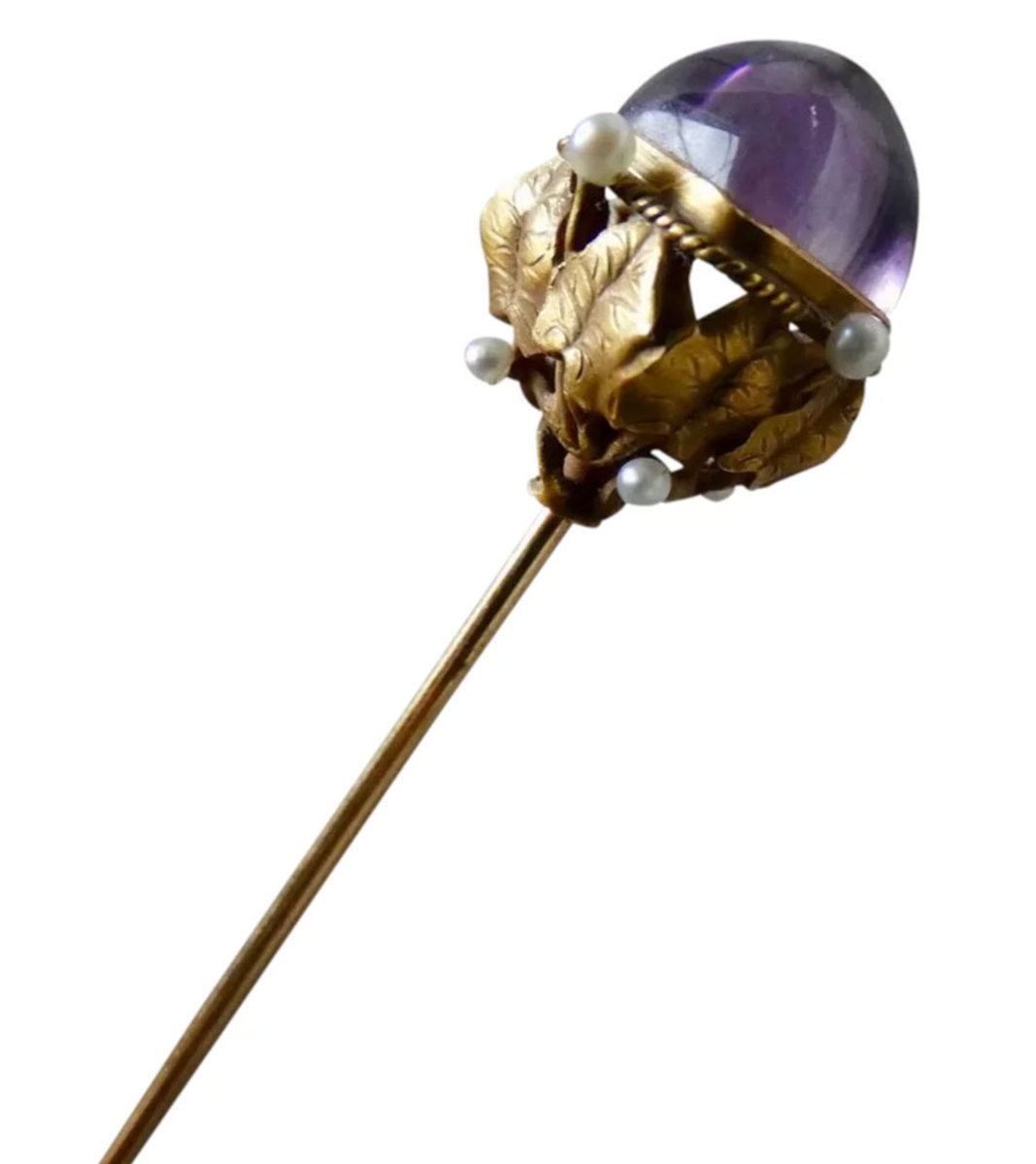 Victorian or Art Nouveau 14k gold and amethyst hatpin with a leaf design and seed pearl accents, 7-5/8" l; $450.