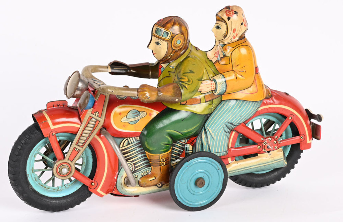 I.Y. Japan "Romance" tin friction motorcycle with male driver and female rider, 12" large version; estimate: $1,500-$2,500.