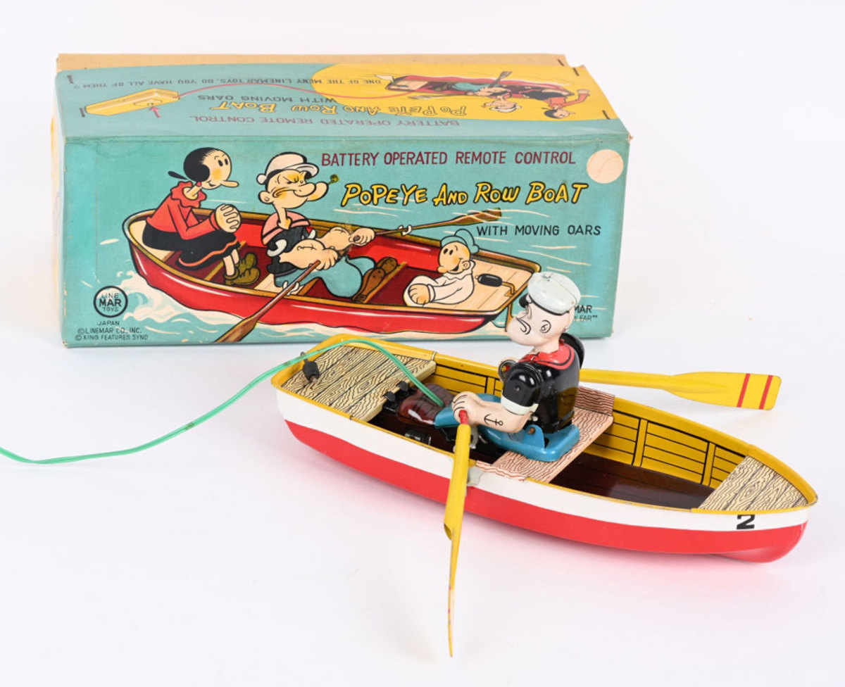 Rare Linemar battery-operated Popeye and Row Boat, 10-1/2", all original and complete with original pictorial box, oars and super-clean correct remote control; estimate: $2,500-$3,500.
