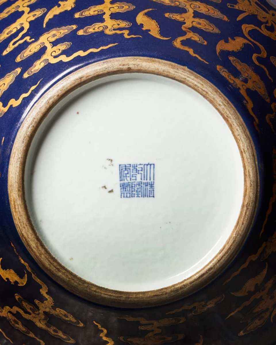 The vase carries the distinctive six-character mark of the Qianlong period (1736-1795) on its base.