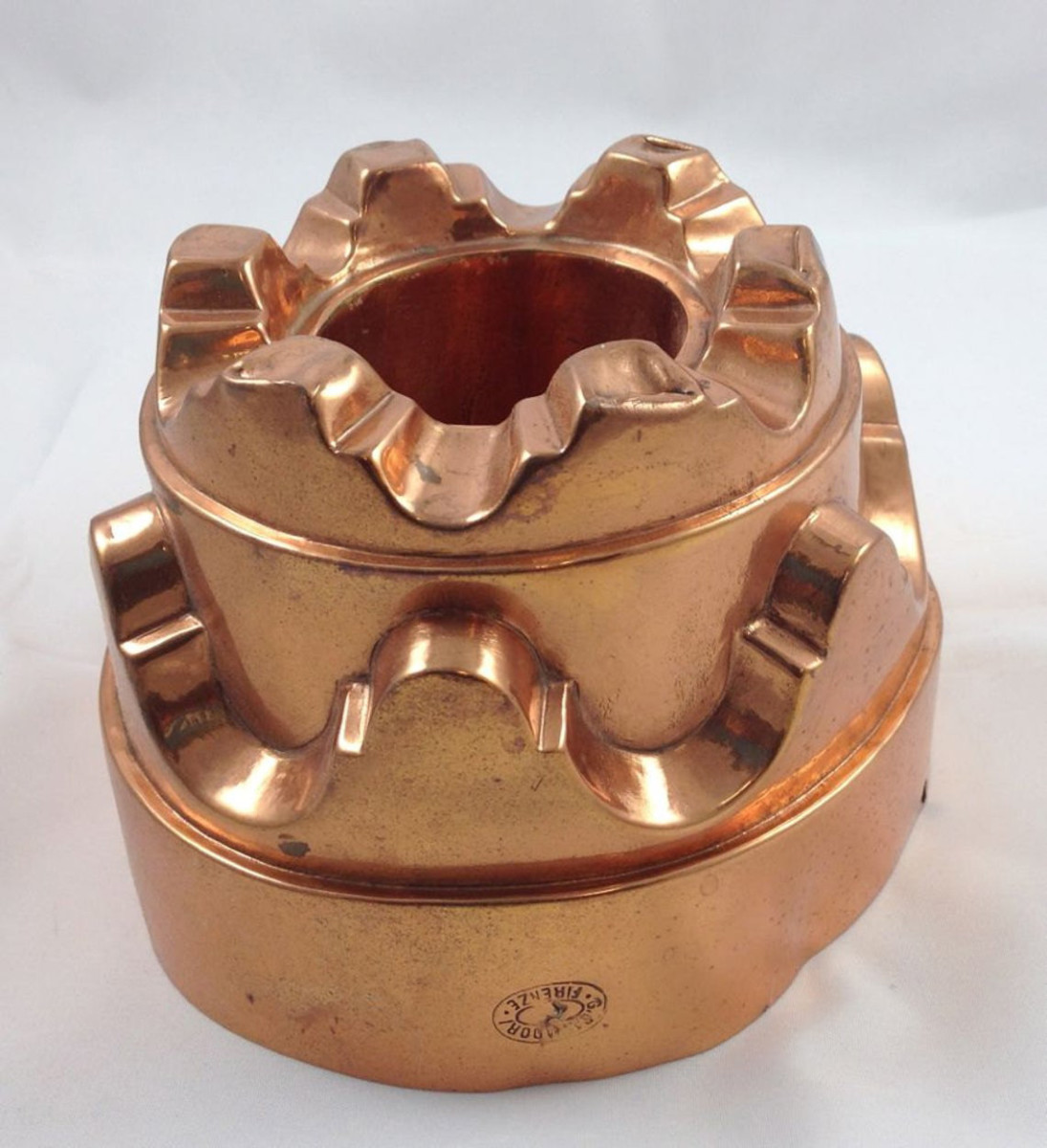 Copper mold by Salvatore Firenze, Italy, circa 1900, has three tiers that give it the appearance of height, 5" dia, 4" h; $234.95.