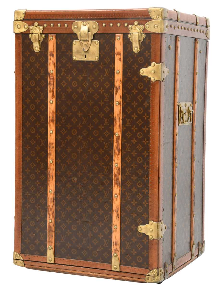 Louis Vuitton monogram steamer trunk, early 20th century, marked "Louis Vuitton," interior with two covered compartments, slide out writing desk and two drawers 36" x 22" x 20". This has an estimate of $6,000-$8,000, but bidding has already pushed it past $10,000 at last check.