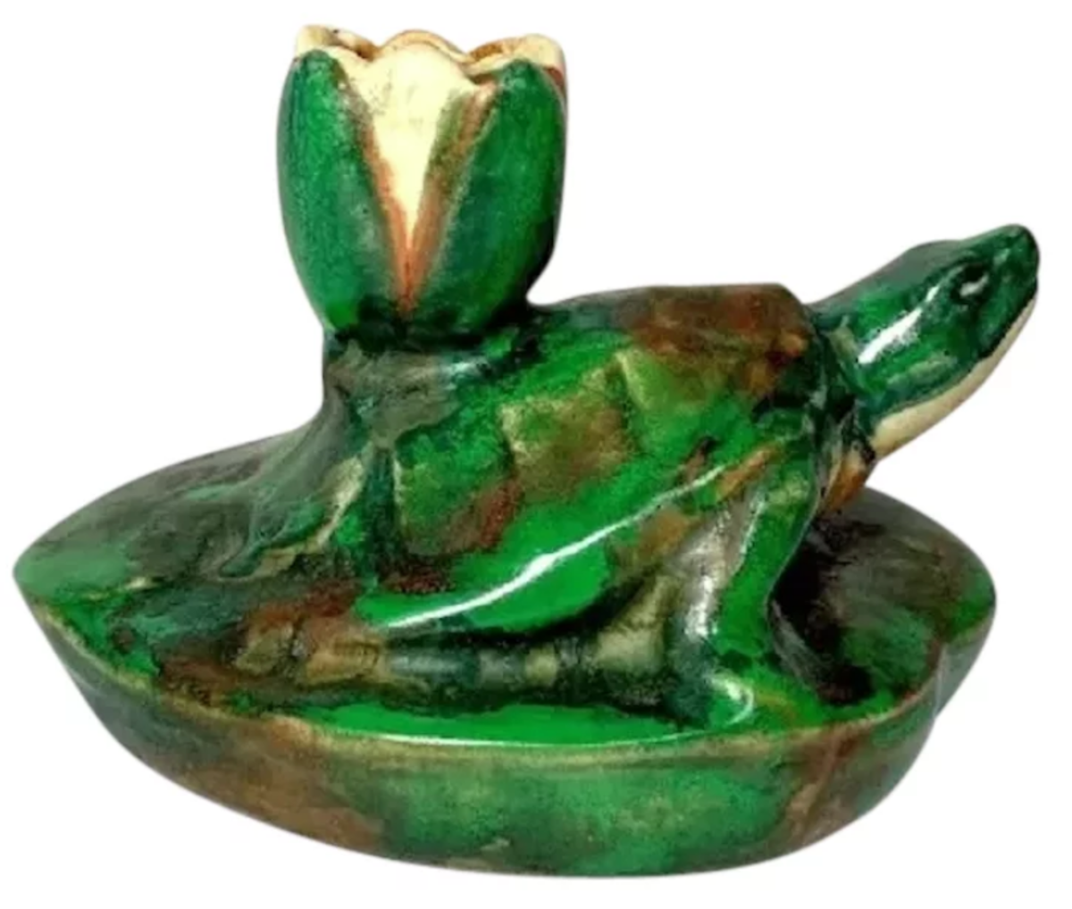 Coppertone turtle and lotus blossom candle holder; $395.