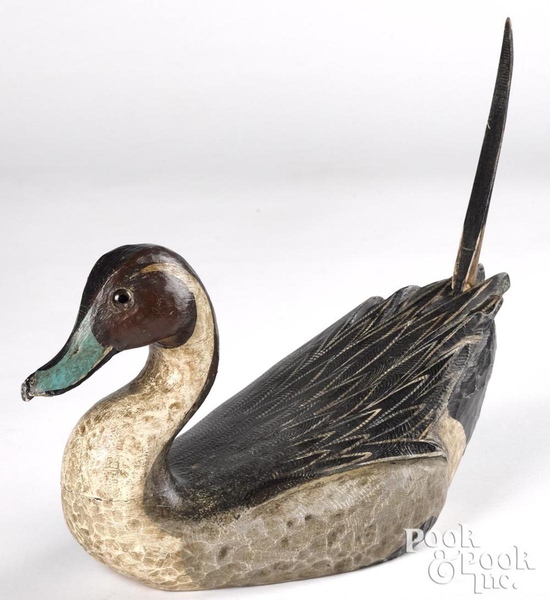 Lou Schifferl (Wisconsin b. 1931), carved and painted pintail duck decoy, signed on underside, 13-3/4" l; estimate: $160-$220.