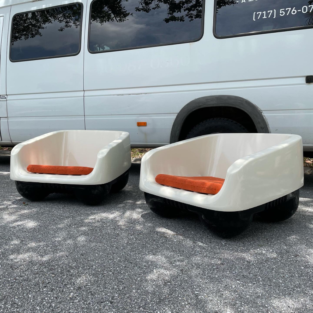 A pair of chairs produced by Ampaform  in Italy that they found on their travels. These are  some of the only examples of this model chair to come  to market in recent years.