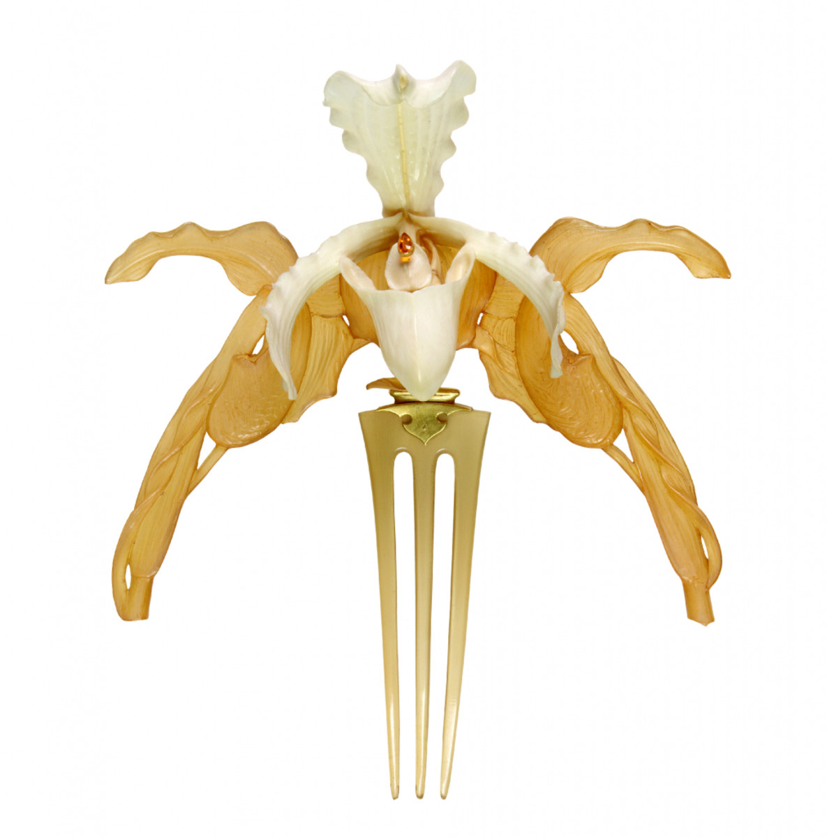 Orchids diadem: The body of this other beautiful orchid diadem, circa 1903-1904, consists of two of the flowers: one in horn and the other in ivory, with a small drop-shaped topaz in its center. The three-pronged comb is also in horn and connected to the diadem by a gold hinge. Lalique first exhibited a bracelet made of horn at the 1896 Salon and following its success, he continued to produce jewels in horn and ivory during the following years. The exotic orchid was one of the flowers that symbolized the aesthetic movement of the late 19th century, and Art Nouveau jewelers handled the flower with great realism, which is heightened in this case by Lalique’s technical mastery. He started from the real flower yet managed to imbue it simultaneously with elegance and a powerful erotic charge.