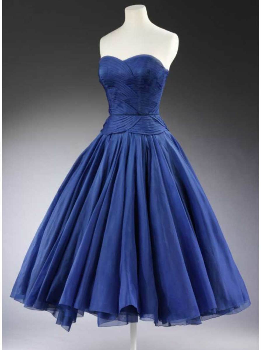 Designed by Jean Dessès, Princess Margaret, Countess of Snowdon, wore this blue silk cocktail dress in 1951.