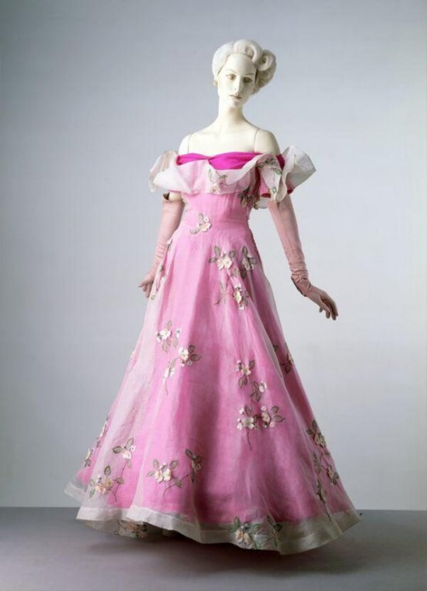 Schiaparelli evening dress, spring/summer, 1953. In this dress she toned down the shocking pink with an overlay of semi-transparent white organza. The dress was worn by the Duchess of Devonshire and is part of the Cecil Beaton Collection.