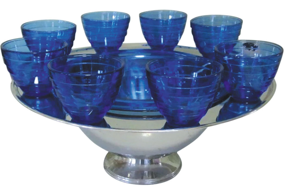 This 1940s Art Deco Saturn punch bowl set by Hazel Atlas, in chrome and cobalt glass, is begging to be filled with an out-of-this-world atomic punch. Display on the buffet in your dining room and watch your guests’ jaws drop: $550. 