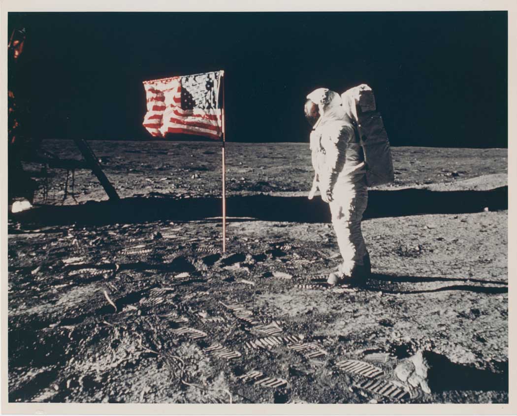 buzz-aldrin-posing-for-a-photograph-beside-the-us-flagweb.jpg